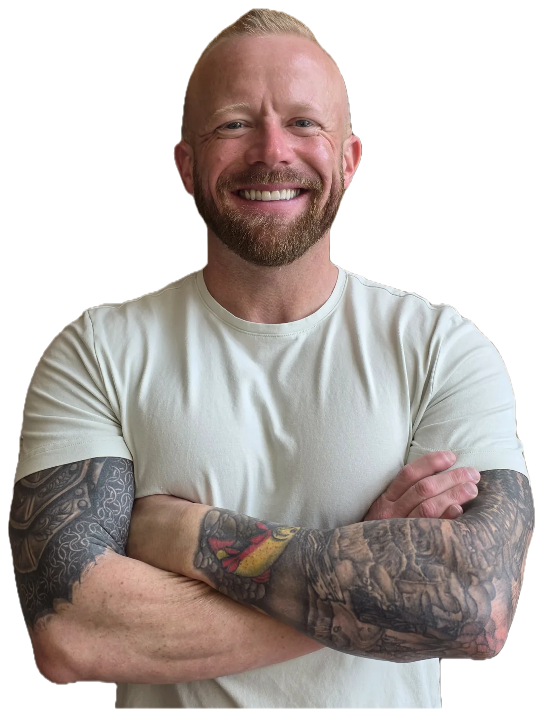 Justin Allan, founder of Vanguard, smiling with his arms crossed